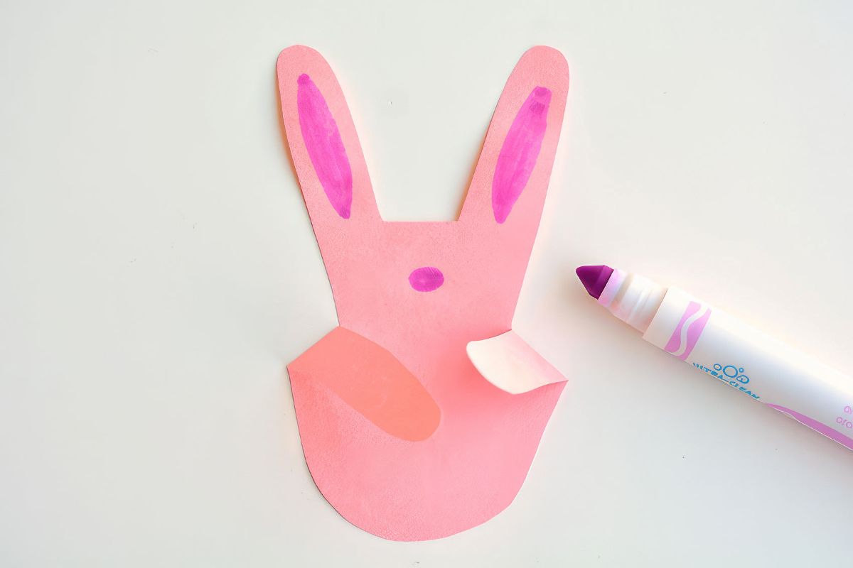 Making-bunnies-with-paper-handprints-11