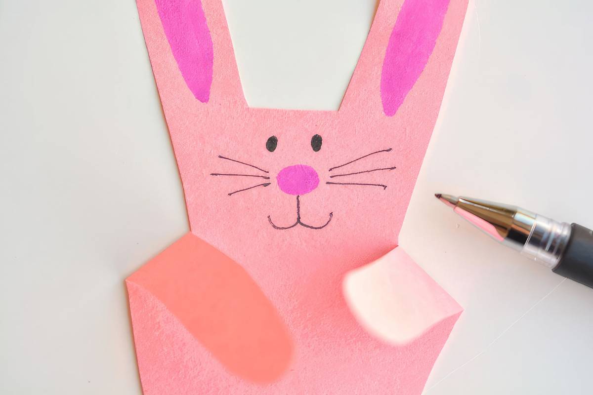 Making-bunnies-with-paper-handprints-12