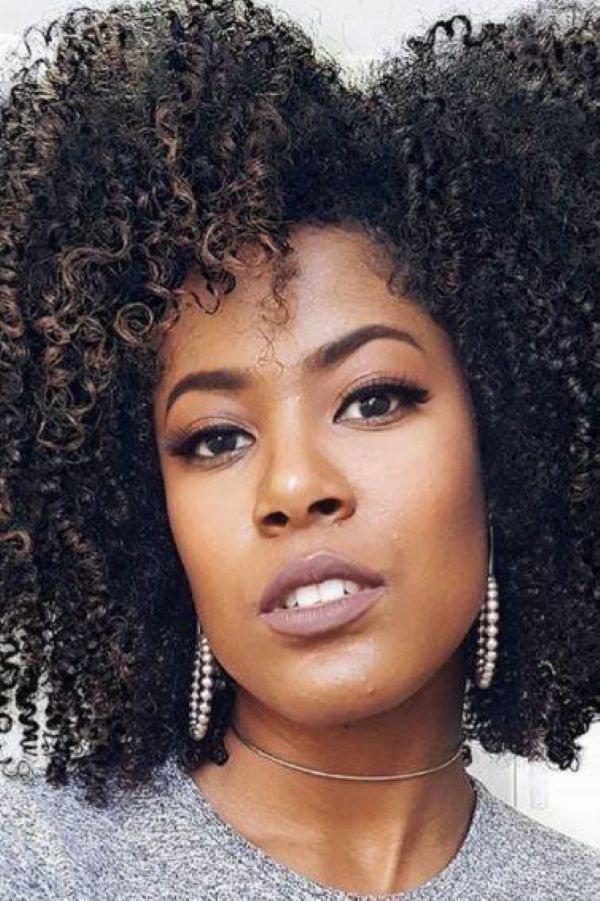 Defined curls shaping the face with effortless dimension