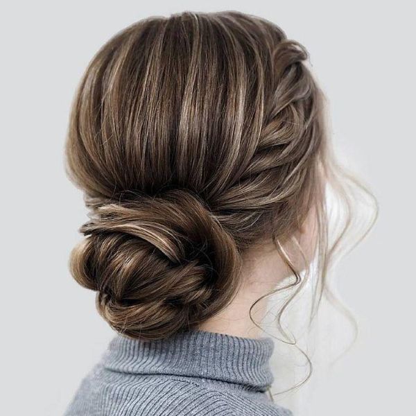 Softly gathered hair with a clean, composed finish