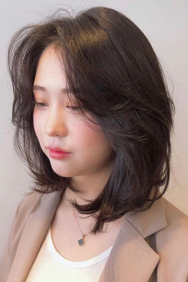 Long layered haircut framing the face softly, ideal for Office Girls
