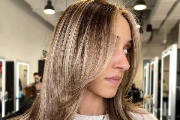Soft front layers drifting naturally around the face