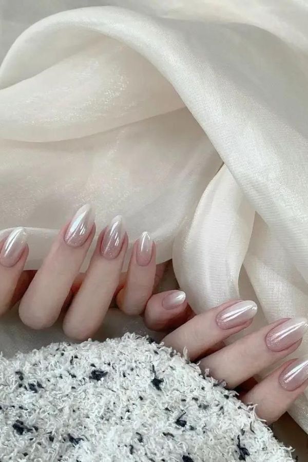 Beige chrome glazed almond nails reflective finish