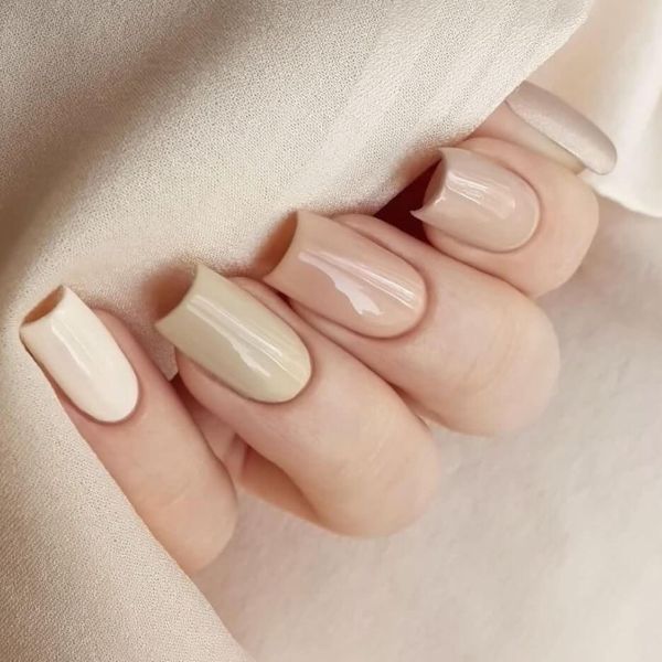 Soft gradient nails touching fabric neutral tones, classy professional nail designs for work