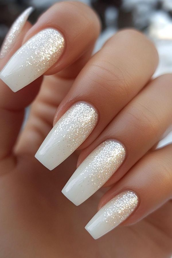 Elegant ombré nail designs for a wedding bridal look with white glitter fade and diamond dust shimmer