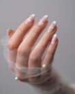 Elegant nail designs for weddings with white French tips and pearl accents on almond nails - Tee Art Online