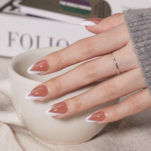 Elegant nude French tip nails with glossy glass finish on almond-shaped bridal nails