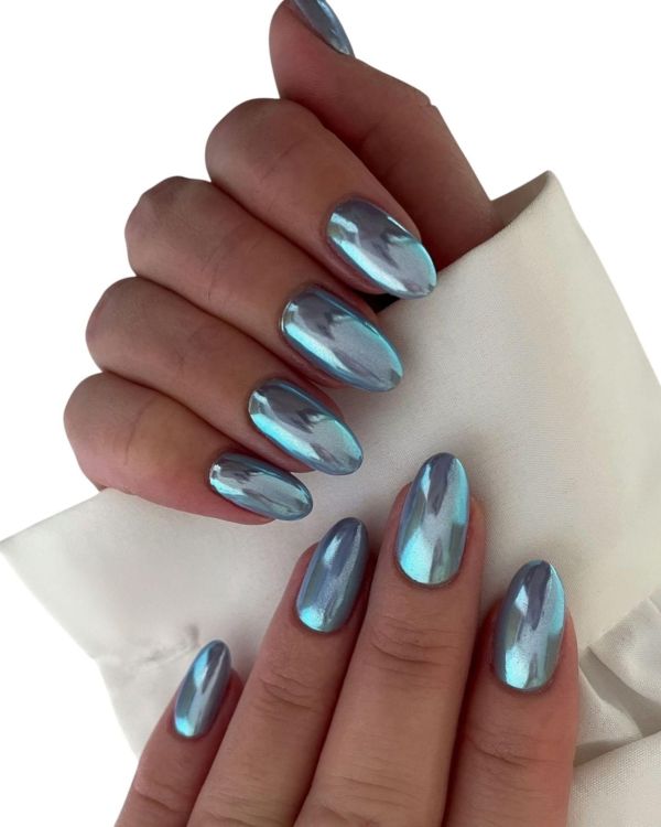 Futuristic luxury bridal nails with icy blue mirror chrome finish on almond nails