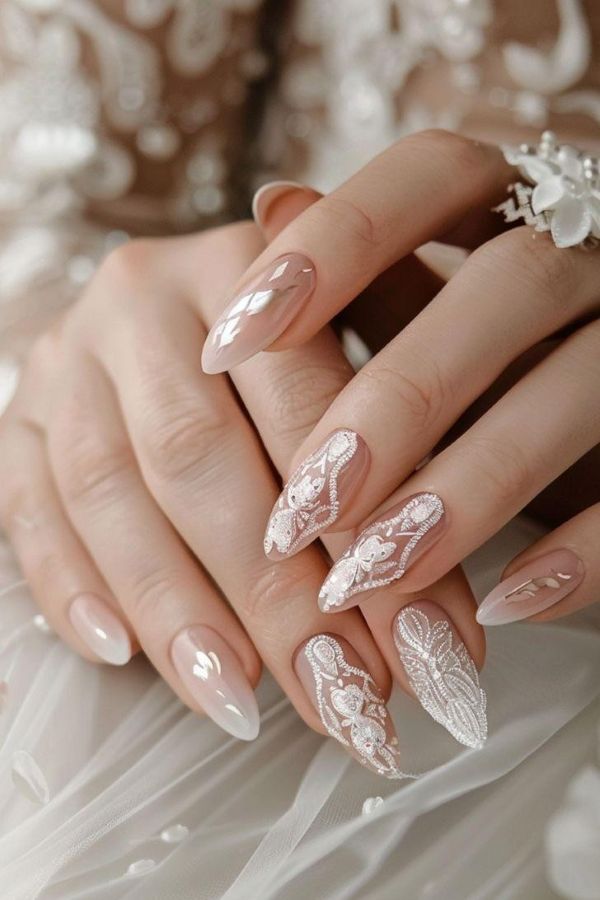 Elegant nail designs for weddings with blush aura nails and delicate white lace nail art on glossy almond nails - Tee Art Online