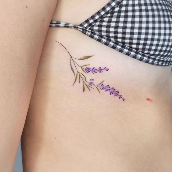 Lavender flower tattoo on waist with delicate purple stems