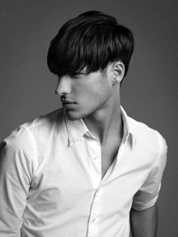men straight hair soft fringe medium length layered haircut long fringe covering forehead clean style