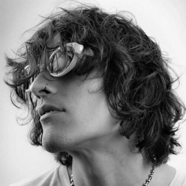 Airy textured shag men medium length straight hair messy layers natural volume soft movement