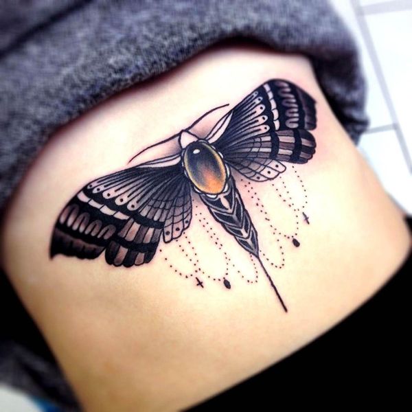 Ornamental Chain Underboob Tattoo Butterfly with detailed wings, black shading, and hanging chain elements