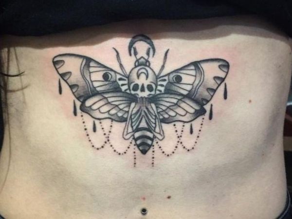 Split Wing Illusion Tattoo underboob with symmetrical moth wings, dripping details, and ornamental chains