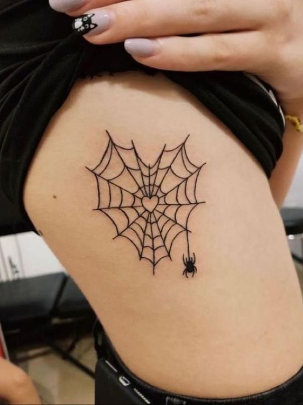 Minimalist spider underboob tattoo with heart-shaped web and tiny hanging spider - Tee Art Online