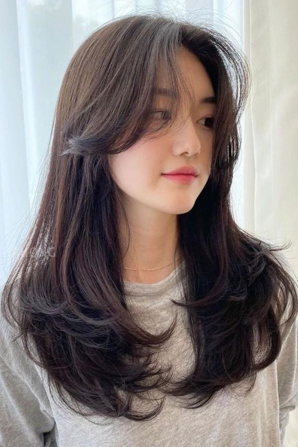 Easy Fairy Hairstyles with soft curtain bangs and airy layered waves